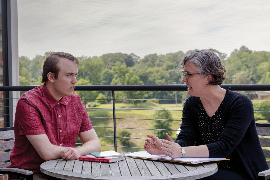 Professor Kaija Mortensen advises a student at Randolph College