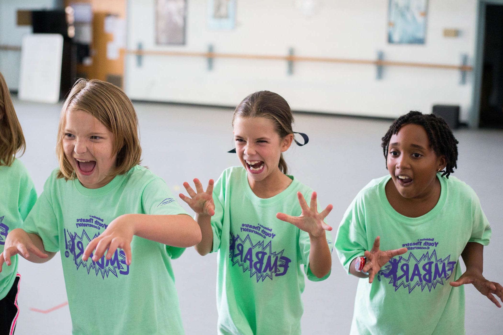 Children practice characters in an Embark acting class.